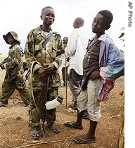 Child solders stand talking near the small village of Boga near Bunia, Democratic Republic of Congo (2004 file photo)