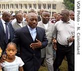 Mr. Kabila with his daughter going to vote