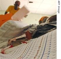 Ballot papers arrive at a counting center in Kinshasa