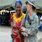 U.S. Army Maj. Angie Allmer assists a Congo resident to the medical waiting area in Kinshasa, Democratic Republic of the Congo, Sept. 14, 2010.