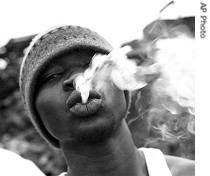 Die, 18, who has been in the streets for the past five years, exhales smoke from a marijuana joint, 6 Aug 2006 