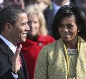 Barack Obama, with wife Michelle at his side, takes oath of office from Chief Justice John Roberts at US Capitol, 20 Jan 2009