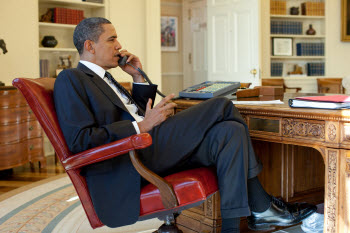 U.S. President Barack Obama on the phone in the White House Oval Office in 2010