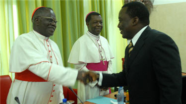 Cardinal Laurent Monsengwo Pasinya greets President Joseph Kabila on February 25, 2011