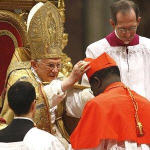 Newly-elevated Cardinal Laurent Monsengwo Pasinya, of the Democratic Republic of Congo, receives the red three-cornered biretta hat from the Pope during a consistory inside St. Peter's Basilica, at the Vatican, 20 Nov 2010