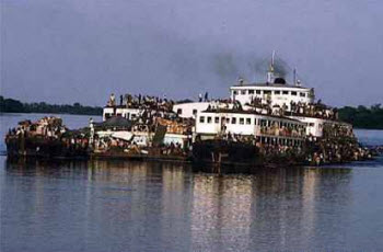 Overloaded boats on the Congo River